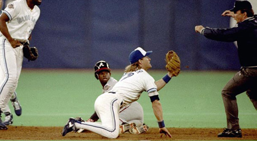 Handy Man: Kelly Gruber holds infant son Kody in one hand and smacks a  single with the other in Blue Jays' annual father-kids game yesterday – All  Items – Digital Archive 