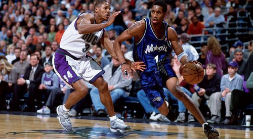 Tracy McGrady of the Orlando Magic shoots a jumper over George